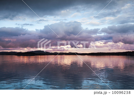 Natural photo background with dark evening Clouds over the seaco 10096238