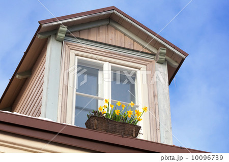 Attic with flowers on the window sill. Old part of Tallinn, Estonia Attic with flowers on the window sill. Old part of Tallinn, Estonia 10096739