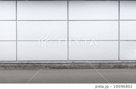 Urban background interior with gray metal wall and asphalt Urban background interior with gray metal wall and asphalt 10096802