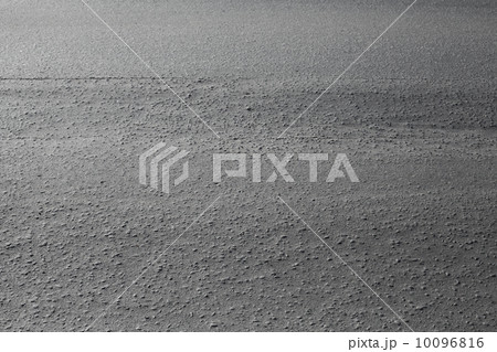 Close-up texture of gray urban asphalt road Close-up texture of gray urban asphalt road 10096816