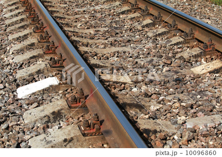 Railway closeup details photo with gray gravel 10096860
