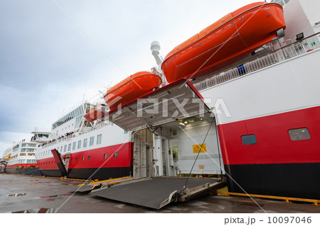 Open side ramp gate on big passenger ferry in port Open side ramp gate on big passenger ferry in port 10097046