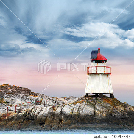 Norwegian lighthouse. White tower on rocky island 10097348