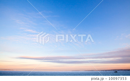 Deep blue morning sky background texture with windy clouds Deep blue morning sky background texture with windy clouds 10097353