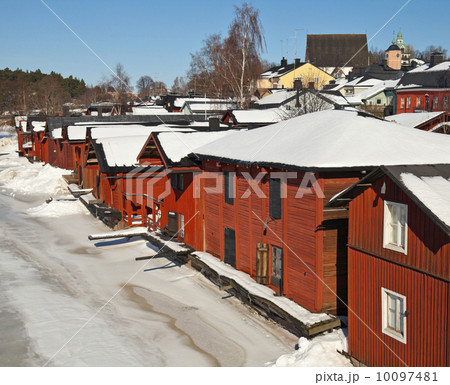Red wooden houses on the river coast in Porvoo town, Finland (winter season) 10097481