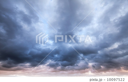 Dark blue stormy cloudy sky natural photo background 10097522