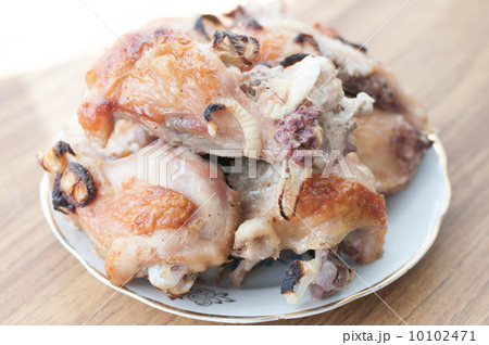 Grilled chicken legs on plate 10102471