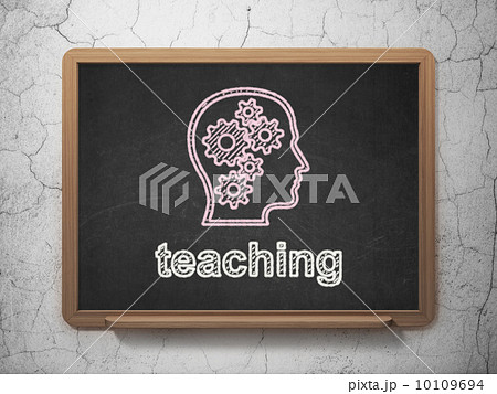 Education concept: Head With Gears and Teaching on chalkboard background 10109694