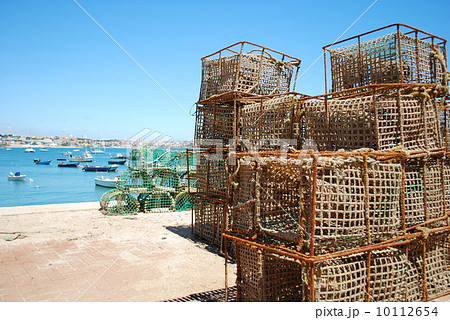 Old fishing cages in the port of Cascais, Portugal Old fishing cages in the port of Cascais, Portugal 10112654