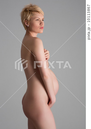 Nude portrait of the young pregnant woman.Studio shoot 10113867