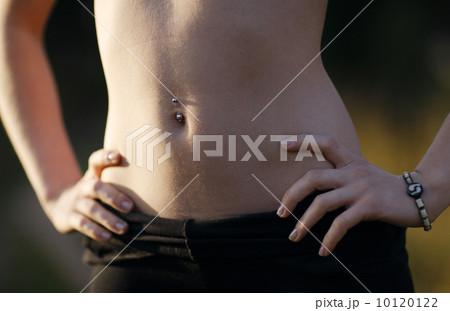 Girl belly with piercing 10120122