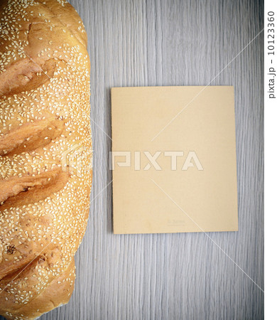 Fresh Tasty Bread on Woody Background 10123360