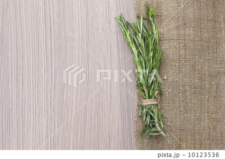 Rosemary Bound on a Wooden Board Background. 10123536