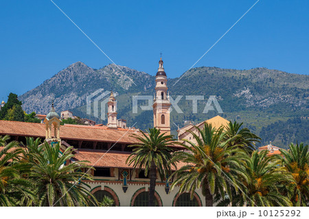 Belfry among houses and palms in Menton, France. Belfry among houses and palms in Menton, France. 10125292