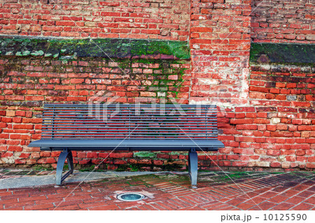 Metal bench and old brick wall in Alba, Italy. Metal bench and old brick wall in Alba, Italy. 10125590