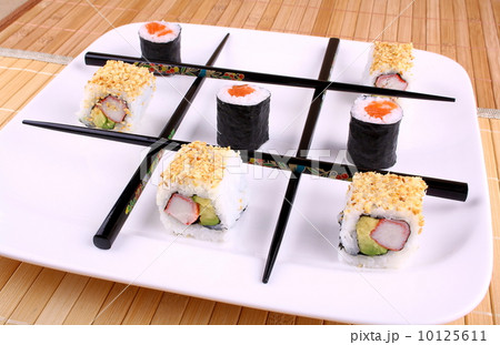 Tic tac toe from chopsticks and Sushi 10125611