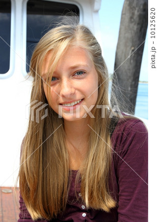 Smiling blonde girl on the ship 10125620