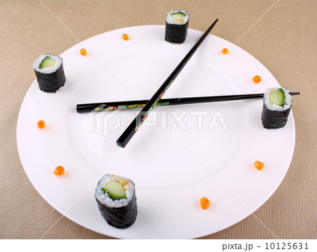 Time Concept with sushi on white plate 10125631