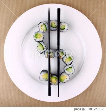 Sushi as dollar sign on white plate, closeup Sushi as dollar sign on white plate, closeup 10125985