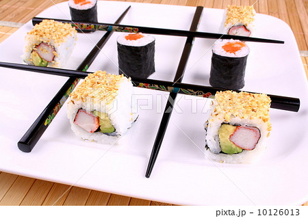 Tic tac toe play with chopsticks and sushi 10126013