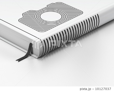 Tourism concept: closed book, Photo Camera on white background 10127037