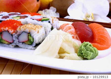 Assorted sushi with wasabi and chopsticks Assorted sushi with wasabi and chopsticks 10129913