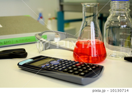 Red liquid in beaker on the table in laboratory Red liquid in beaker on the table in laboratory 10130714