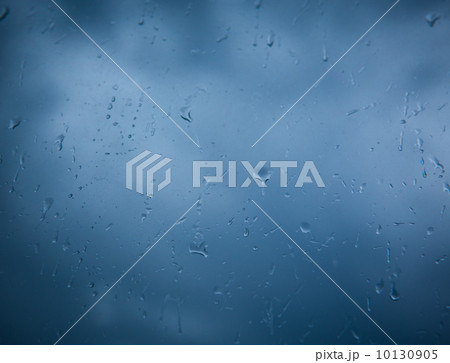 Rain drops on window across clouds 10130905