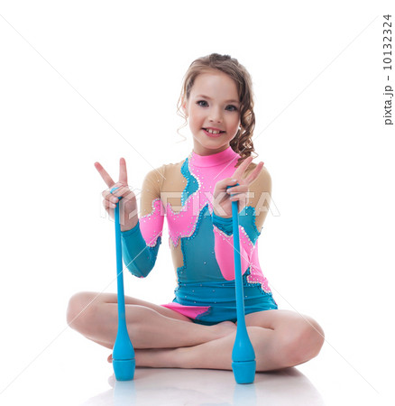 Cheerful little gymnast posing with mace 10132324