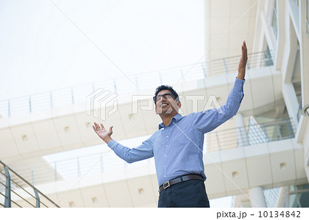 Indian businessman celebrating success at office 10134842
