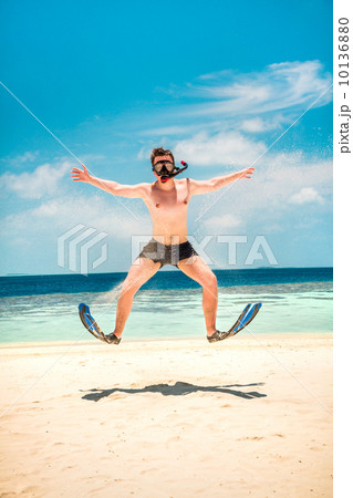 Funny man jumping in flippers and mask. Funny man jumping in flippers and mask. 10136880