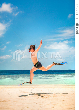 Funny man jumping in flippers and mask. Funny man jumping in flippers and mask. 10136890