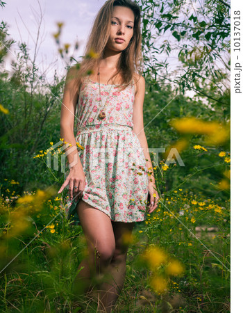 Blonde sexy posing in summer dress Blonde sexy posing in summer dress 10137018