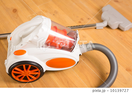 Cleaning of the apartment. Vacuum cleaner on the floor 10139727
