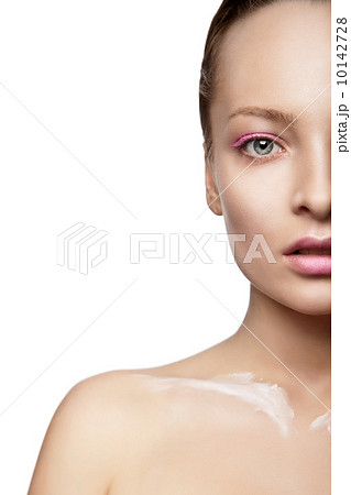Woman with creative make-up and white paint Woman with creative make-up and white paint 10142728
