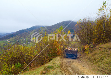 autumn mountain road and old log truck 10145877