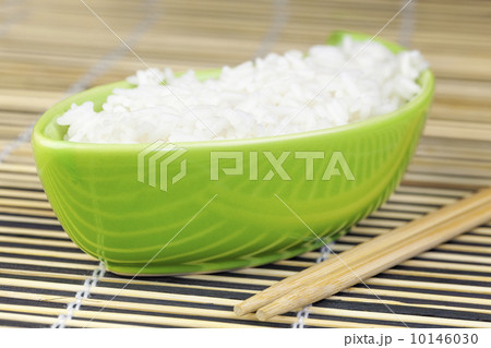Rice in green clay bowl with wooden chopsticks 10146030