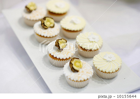 White vanilla cream cupcakes on a white plate 10155644