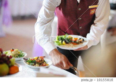 Waiter carrying a plate Waiter carrying a plate 10155810