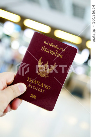hand holding thailand passport hand holding thailand passport 10156654