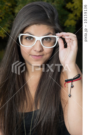 Young girl with white sunglasses Young girl with white sunglasses 10159136