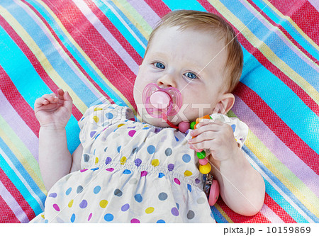 Caucasian little baby girl with multicolored frock 10159869