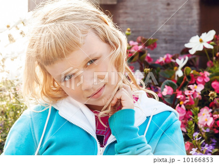 Little beauty blond girl smiles. Bright colorful portrait outdoo Little beauty blond girl smiles. Bright colorful portrait outdoo 10166853