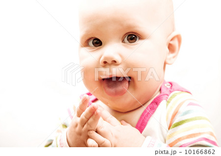 Funny Caucasian baby showing tongue Funny Caucasian baby showing tongue 10166862