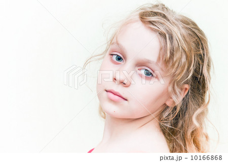 Portrait of a little blond girl above white background Portrait of a little blond girl above white background 10166868