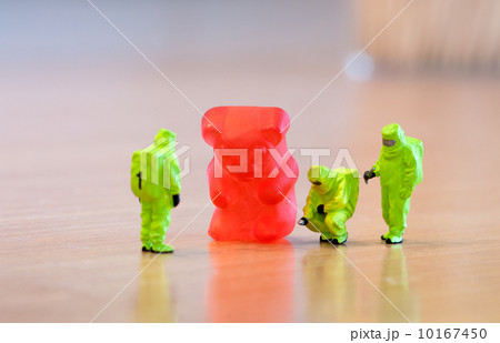 Group of people in protective suit inspecting a jelly bear 10167450