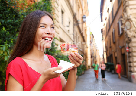 Pizza woman eating pizza slice in Rome, Italy 10176152