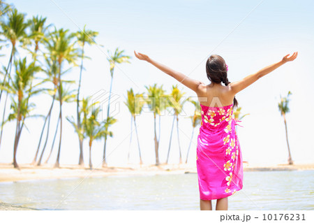 Praising happy freedom woman on beach in sarong 10176231