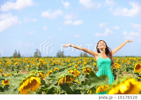 Happy carefree summer girl in sunflower field 10176520