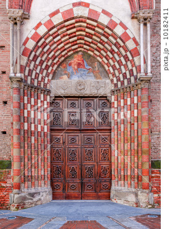 Old wooden door at the entrance to catholic church. Old wooden door at the entrance to catholic church. 10182411